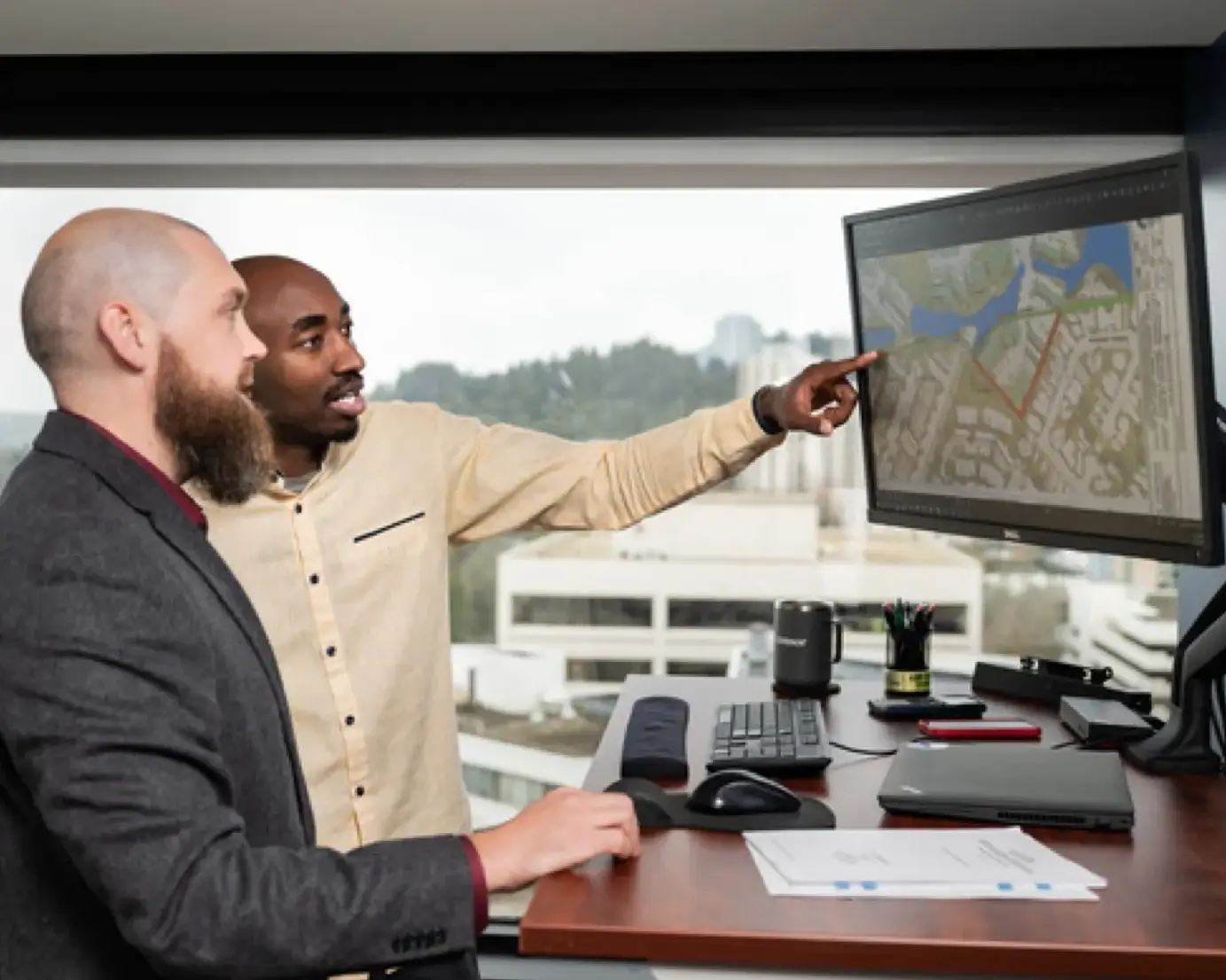 two employees looking at computer