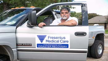 Fresenius Medical Care Disaster Recovery worker standing in doorway of truck