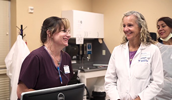 A doctor talking with two nurses