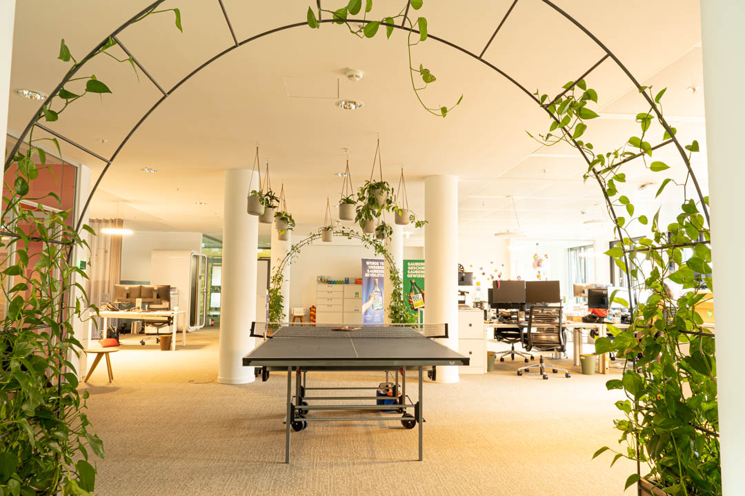 Hamburg office setting showcasing ping pong table, desks, and working space