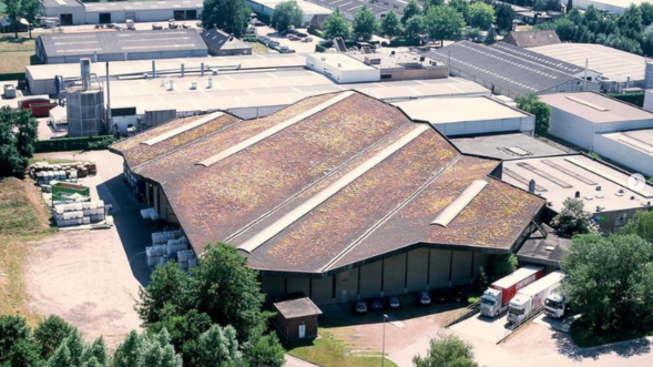 Aerial view of Malle facility with green roof displayed