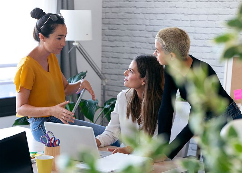 Three people on a sales presentation