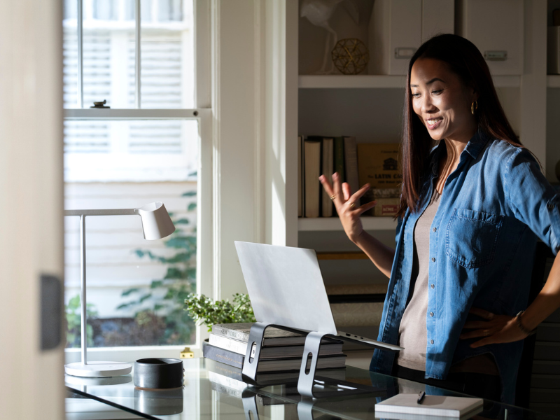 Malaysian Woman in Home Office Standing at Desk