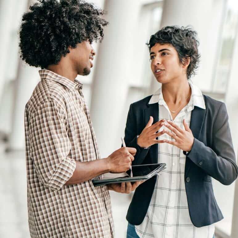 two employees talking