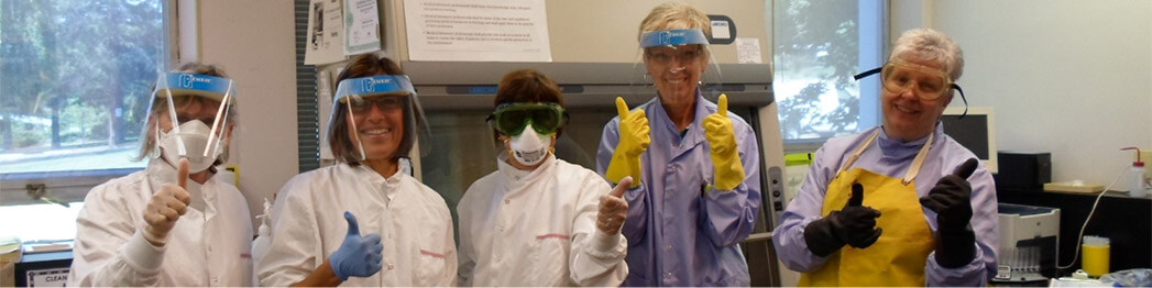 people in lab giving thumbs up