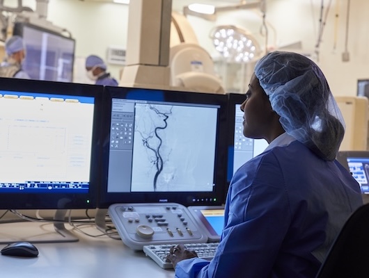 Radiologist looking at a screen