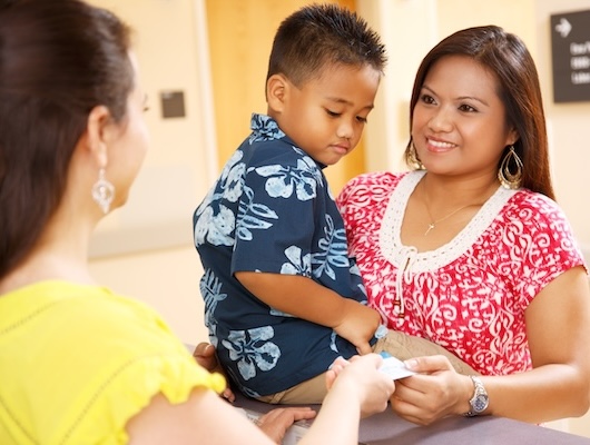 Woman with child checking in at hospital