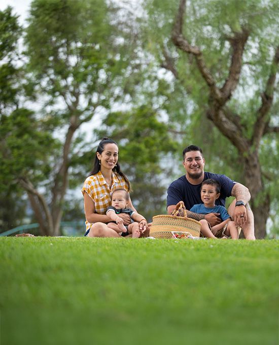 Parents picnicking with baby