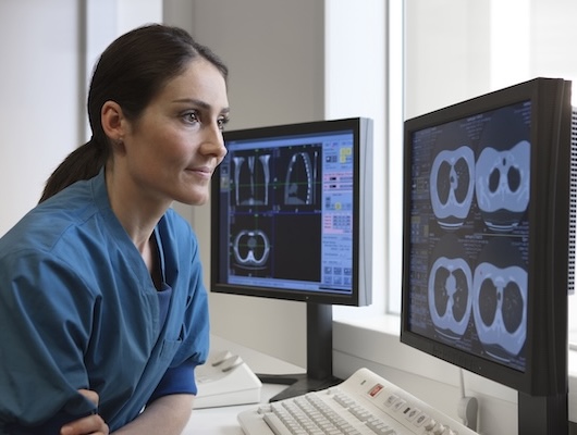 Radiologist looking at a screen