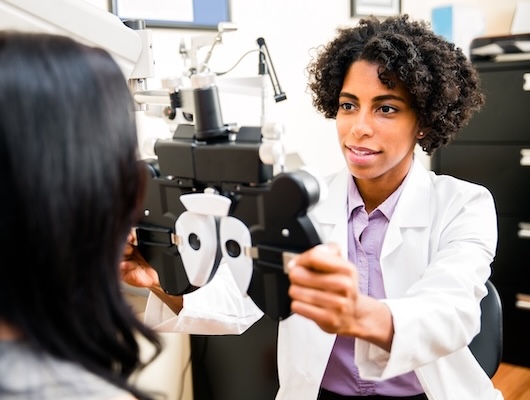 Optometrist with patient