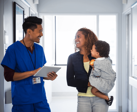 Nurse with mom and baby