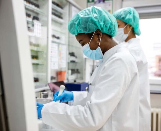 Pharmacists filling prescriptions