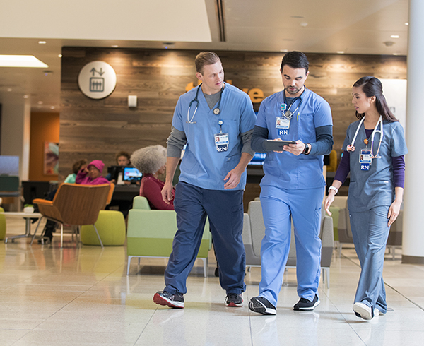 Clinicians walking in the building lobby