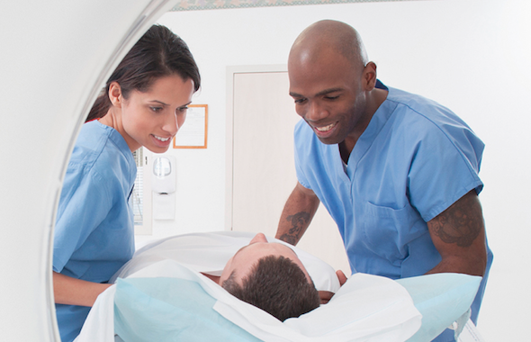 Medical Assistants smiling at patient