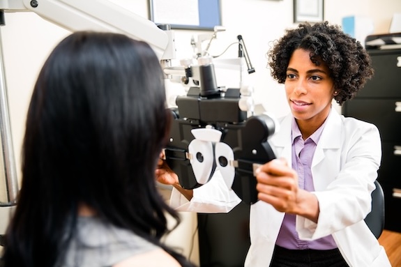 Woman getting her eyes checked at the optometrist