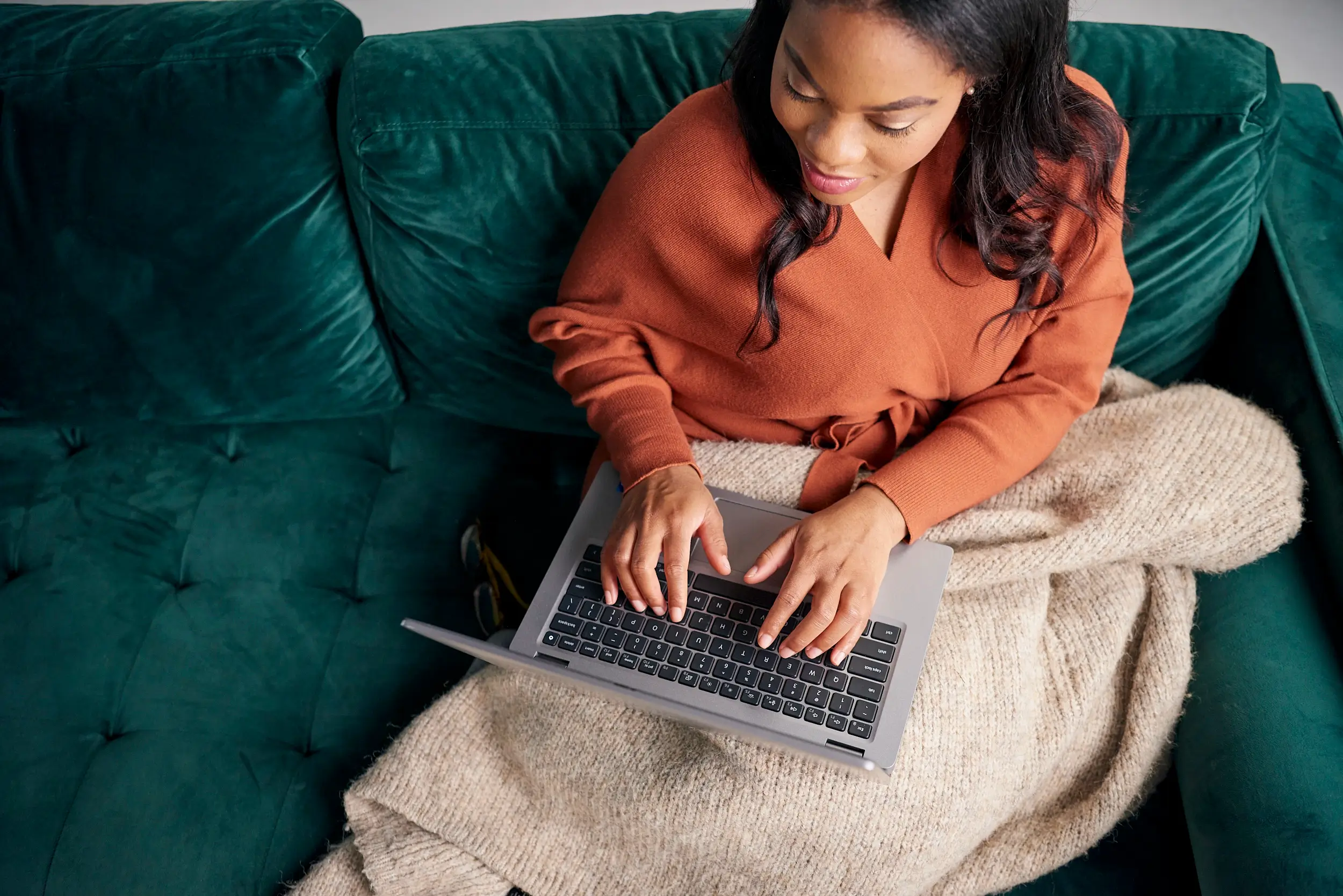 Person typing on a laptop computer