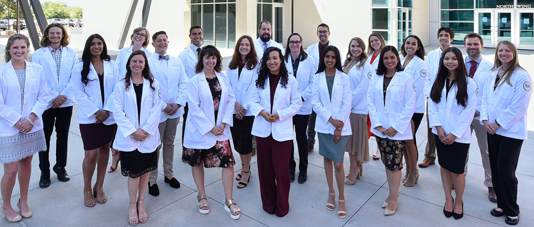 A photo of UNMH medical professionals in white coats