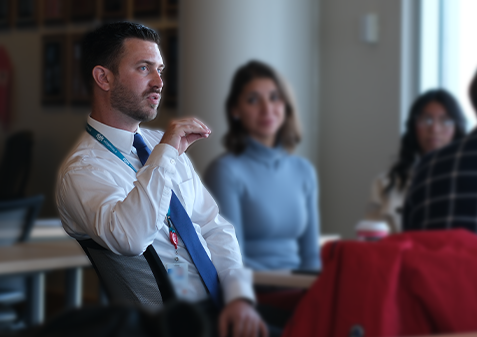 Alex Walker speaks to student interns