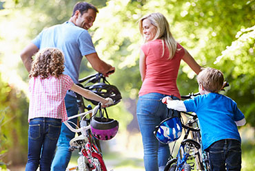 Family riding bikes together