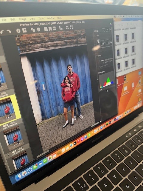 Laptop screen showing images being edited from a photo shoot