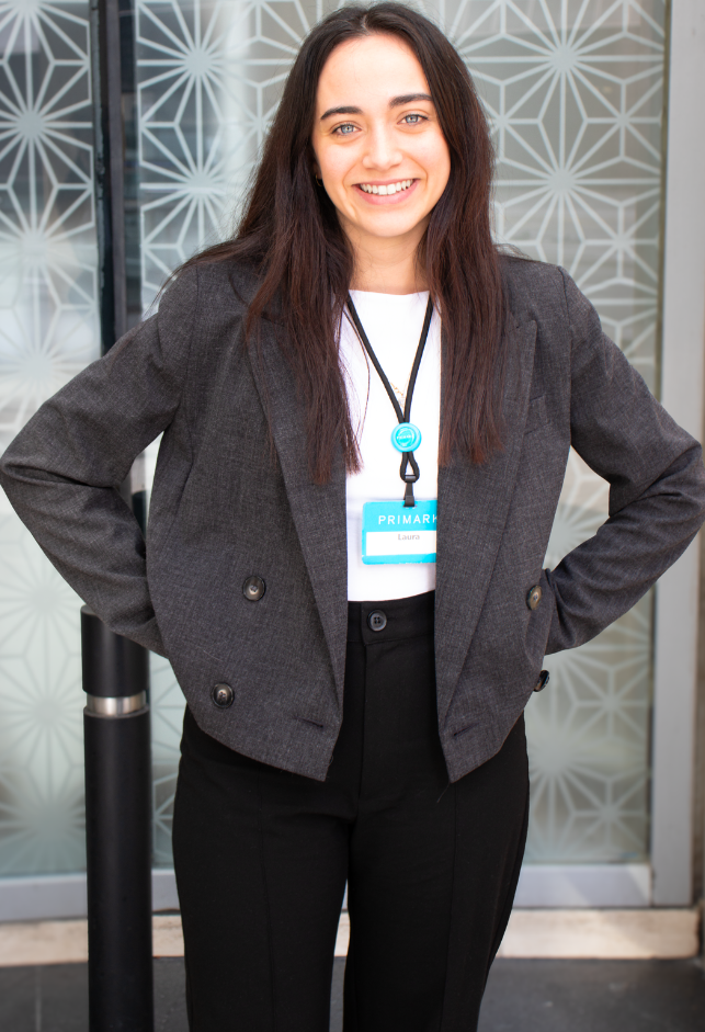 Colleague smiling outside a store
