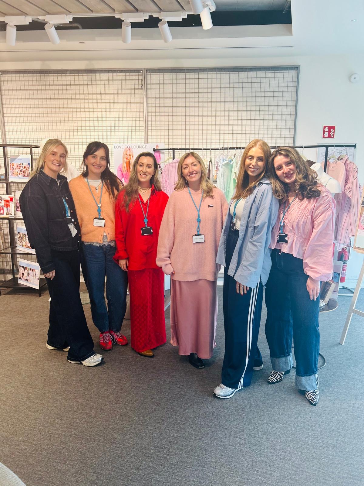 Colleague standing together in meeting room