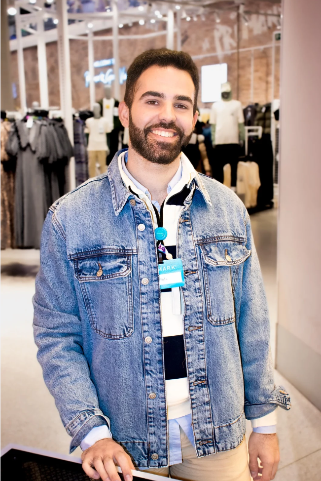 Colleague smiling in store