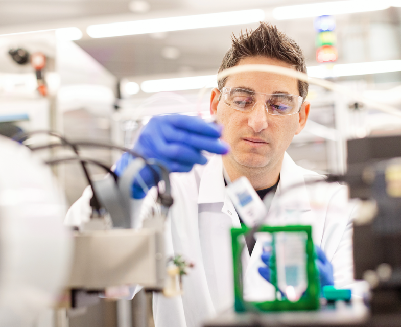 Amgen scientist in an Amgen discovery research lab