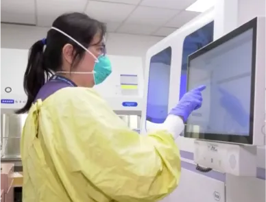 PHSA employee at a clinic in protective gear