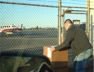 PHSA Supply chain employee lifting boxes