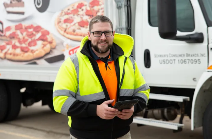 Man standing in front of a delivery truck