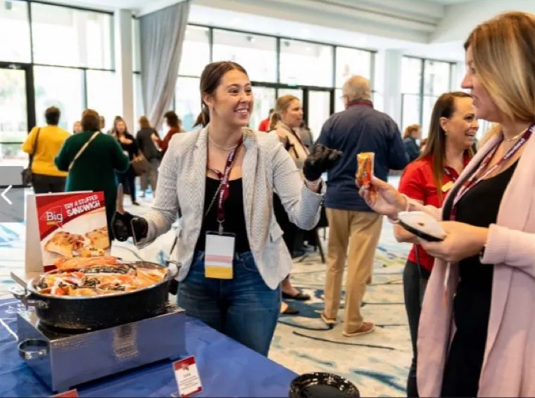 Woman providing food samples at an event