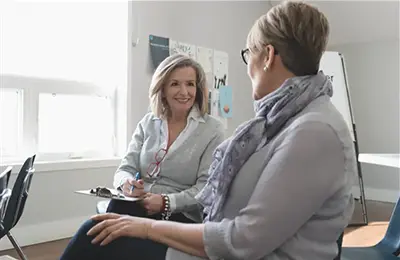 Therapist talking to a patient