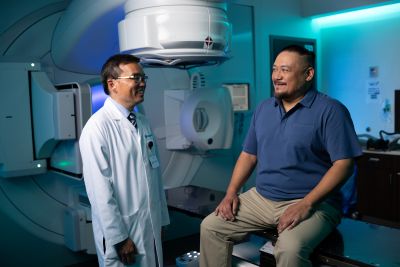 Three people talking in office