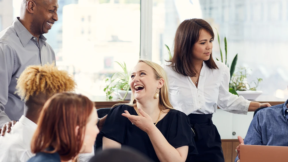 Quad employees bonding in the workplace