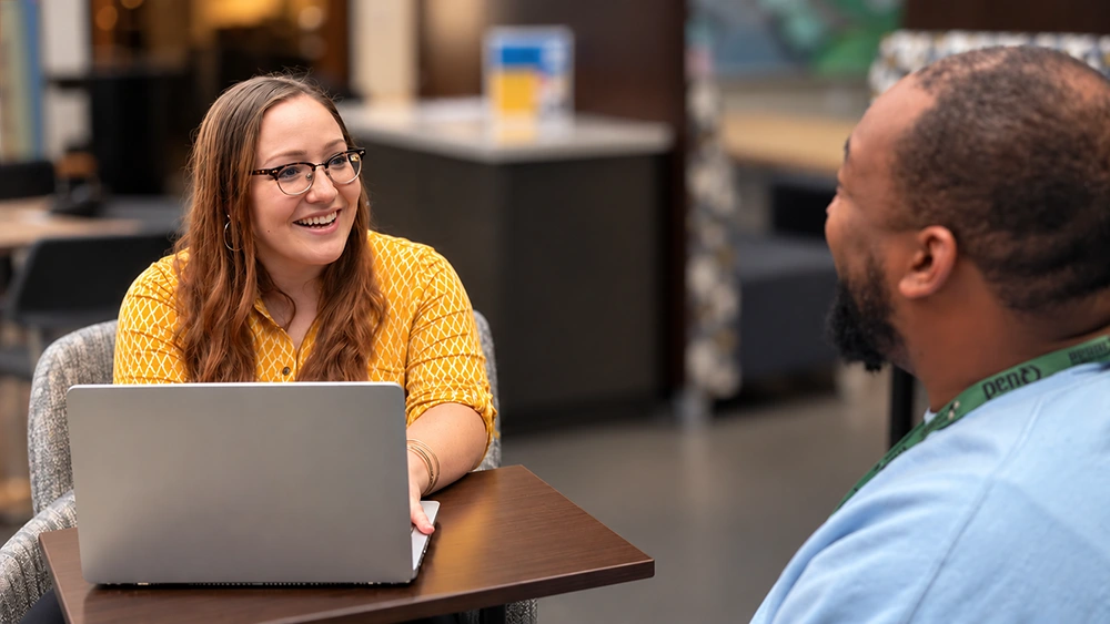 Haley Black speaking with Leon Brown. Photo courtesy of Andrew Baker Cavaliere