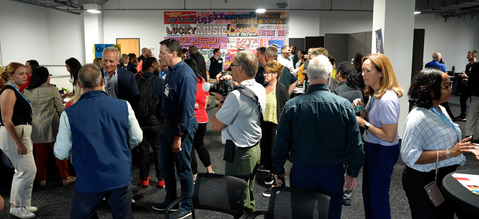 Quad employees, government officials and community leaders gather at Quad MKE.