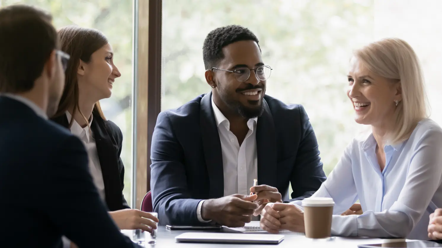 Quad accounting manager mentoring a junior employee
