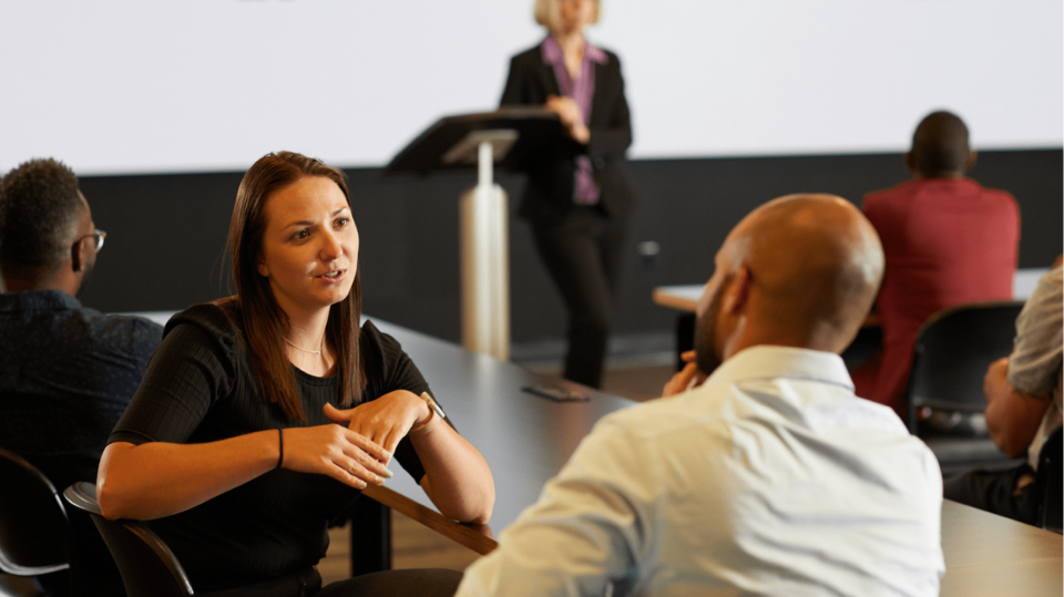 Quad human resource employees in a seminar at headquarters