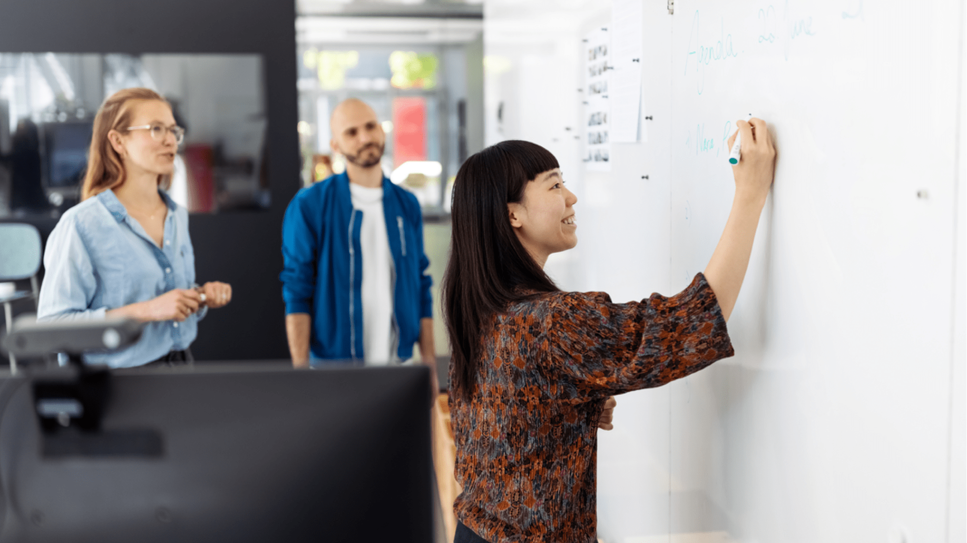 woman working at whiteboard