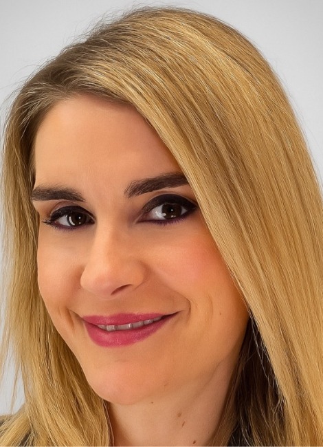 Professional headshot of a woman, Angeliki Nikoli, smiling