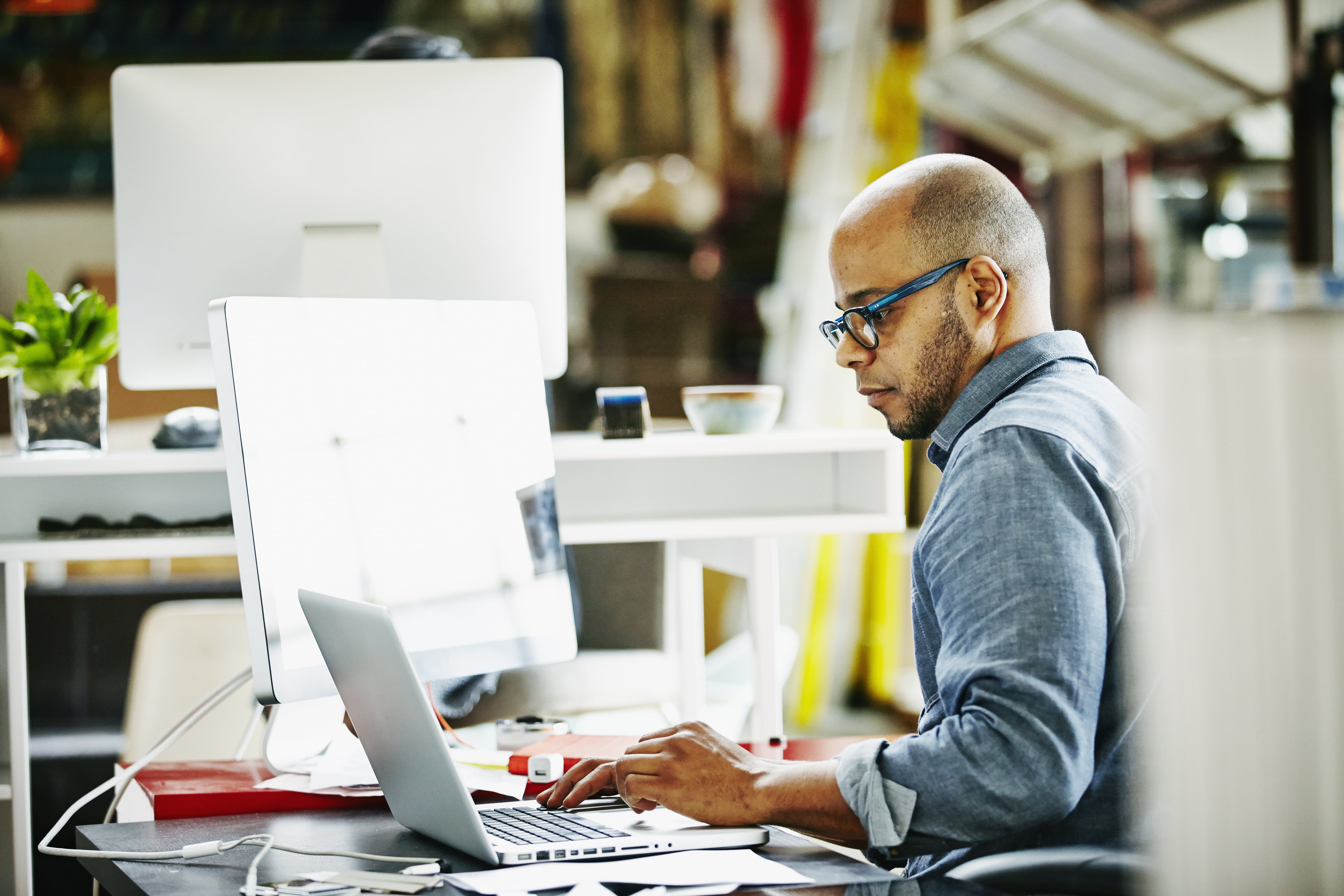 man working on his computer