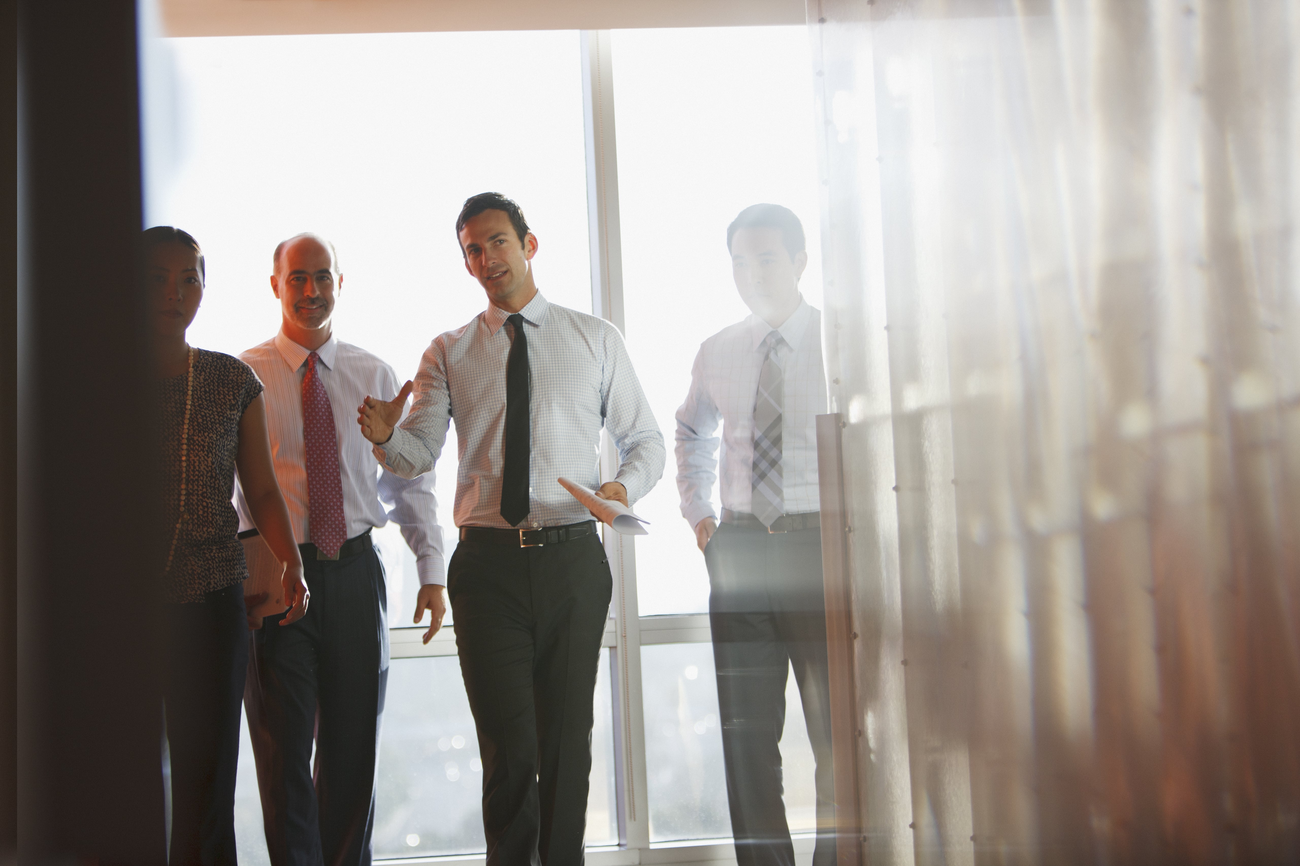 coworkers walking through company building