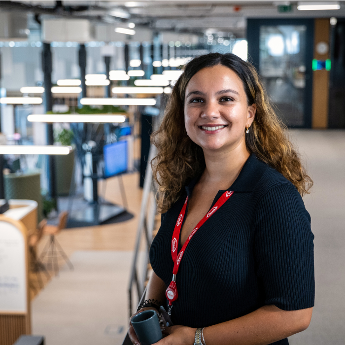 An employee looking at the camera and smiling