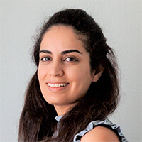 headshot of women smiling with black hair