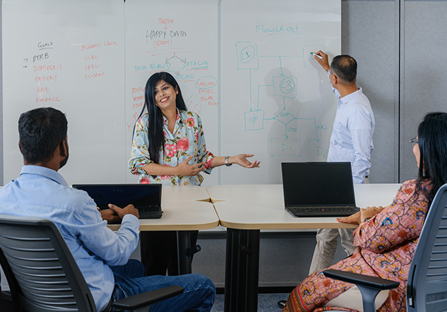 diverse group of office workers smiling and conversing