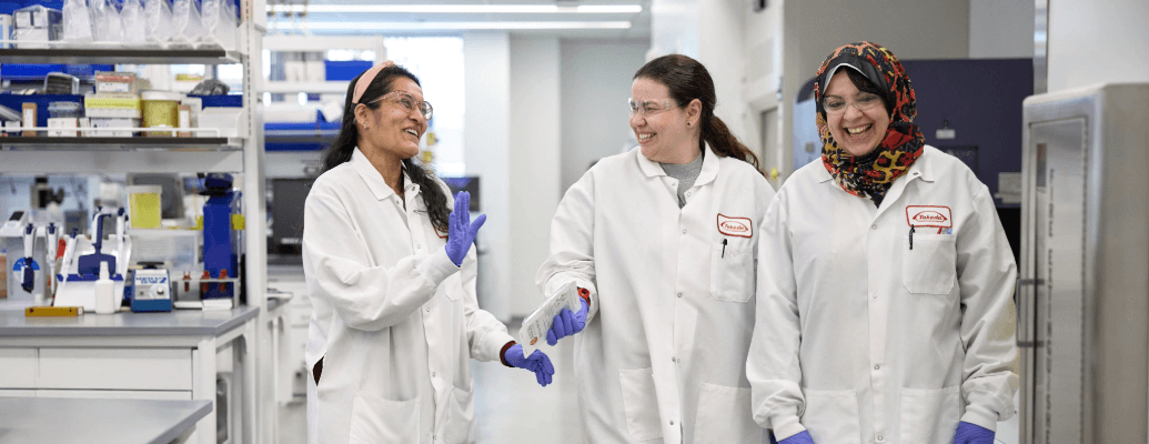 Watch video: lab employees taking a pictures