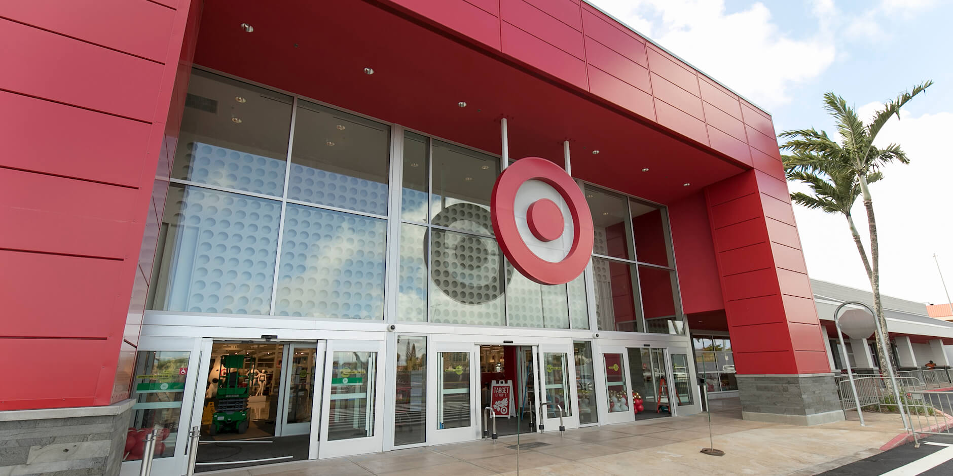 "The entrance to a Target store with a large red bullseye logo above the doors."