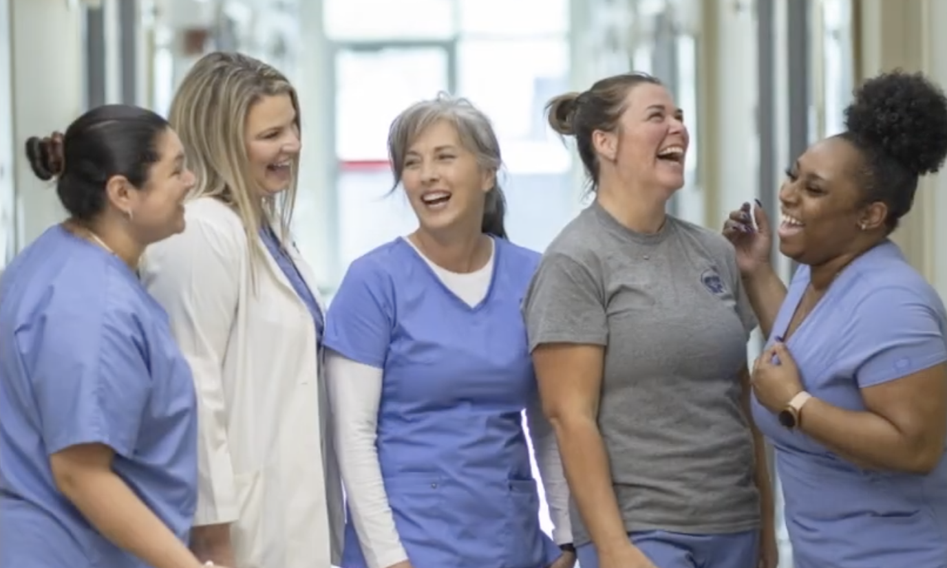 Group of healthcare professionals standing together in a hospital setting