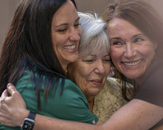 three woman hugging